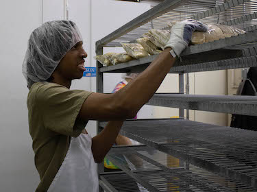  Student working at Food Service center
